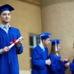 Students receiving scholarship awards at a ceremony, showcasing the recognition of academic excellence and support.